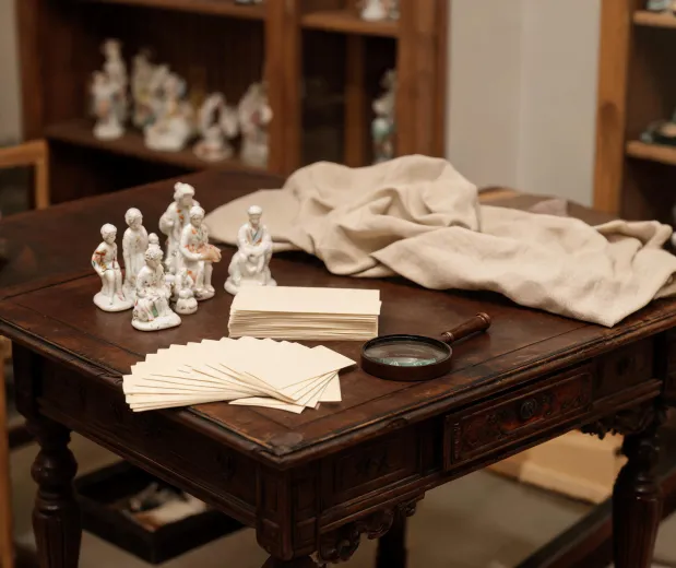 Hummel archive table with figurine reference cards