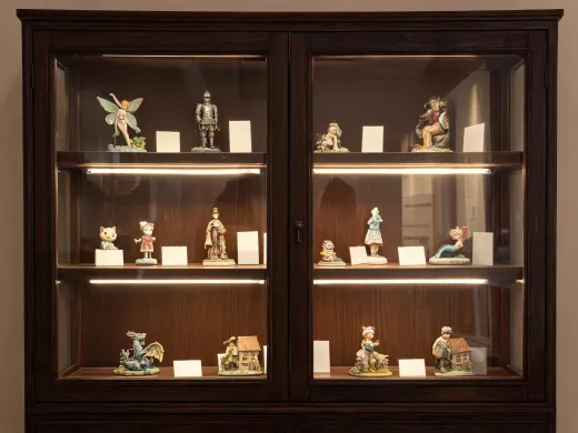 Collector cabinet with labeled figurines